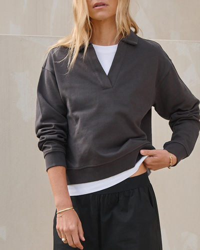 charcoal grey cotton long sleeve top with a relaxed collar and ribbed cuffs for a laid-back vibe