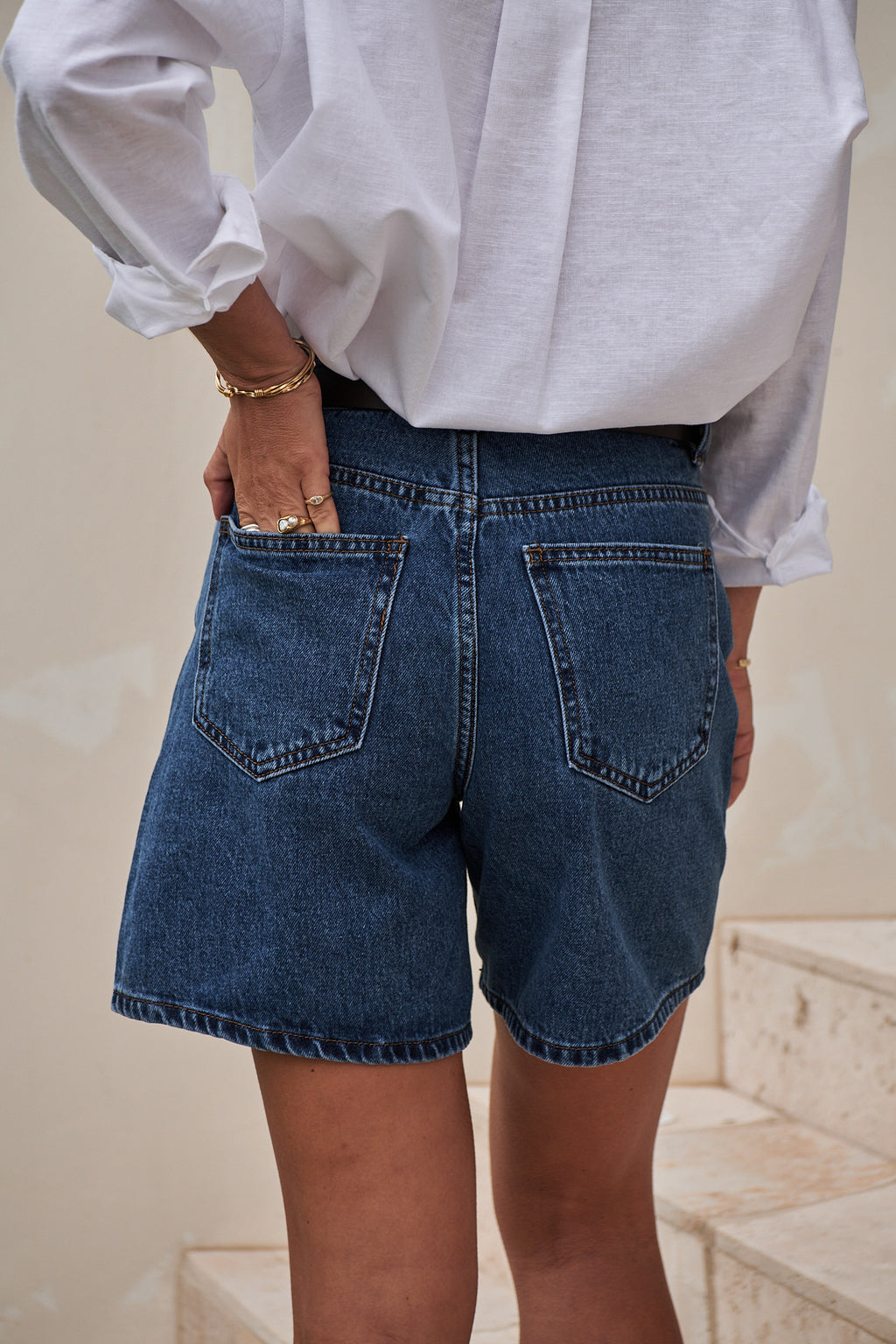 Mid Rise Denim Short - Washed Indigo in rigid denim with a classic washed indigo finish and back patch pockets.