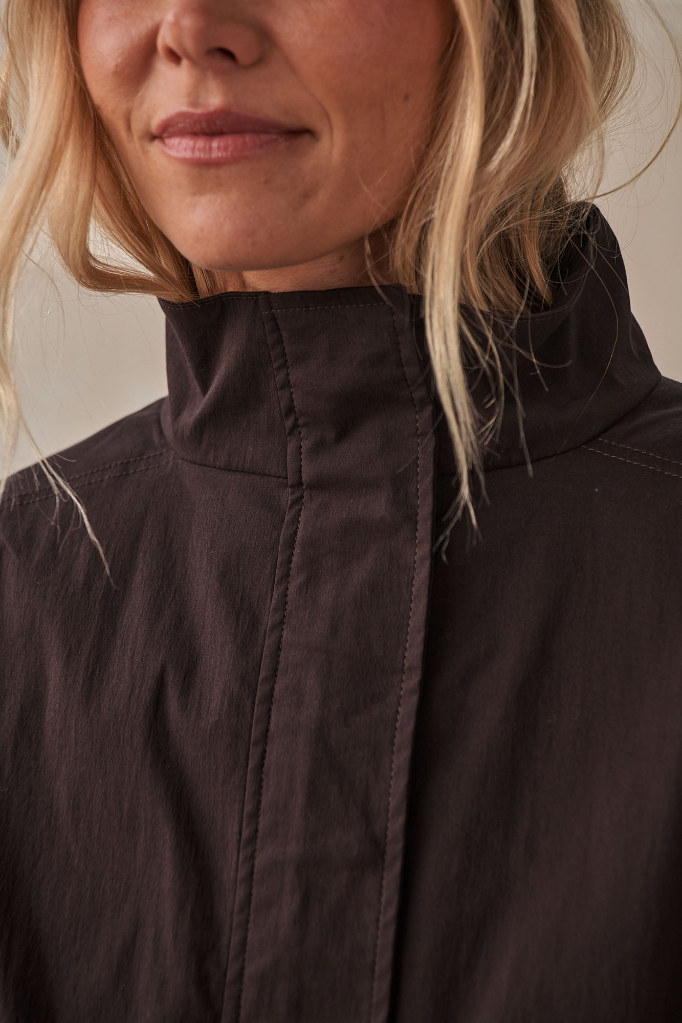 Nylon Track Jacket - Chocolate in a smooth, durable fabric with a high stand collar and minimalist seam detailing for a clean, relaxed look.