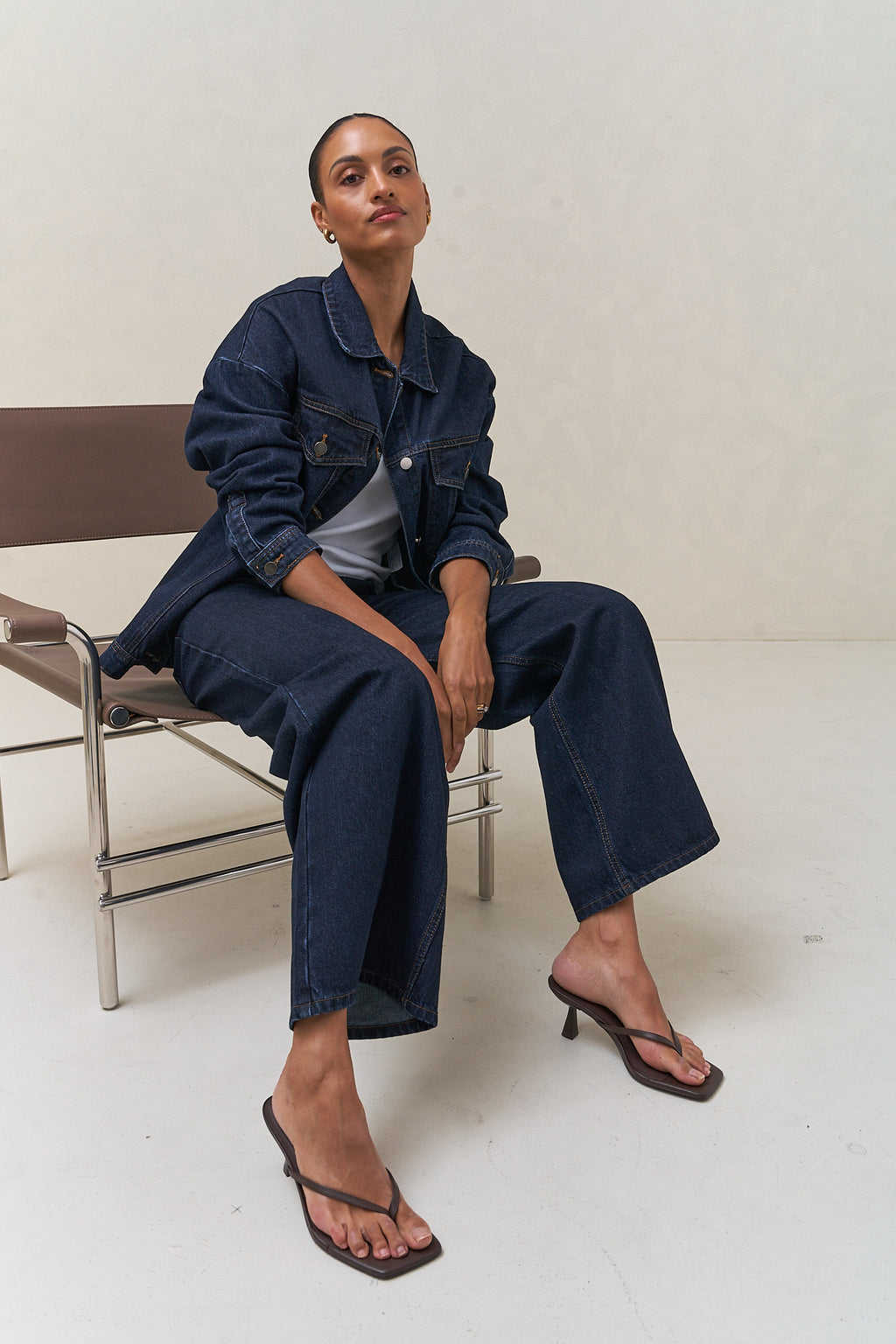 Denim Trucker Jacket - Indigo in rigid denim with a clean silhouette that holds its shape over time for a laid-back, enduring look.