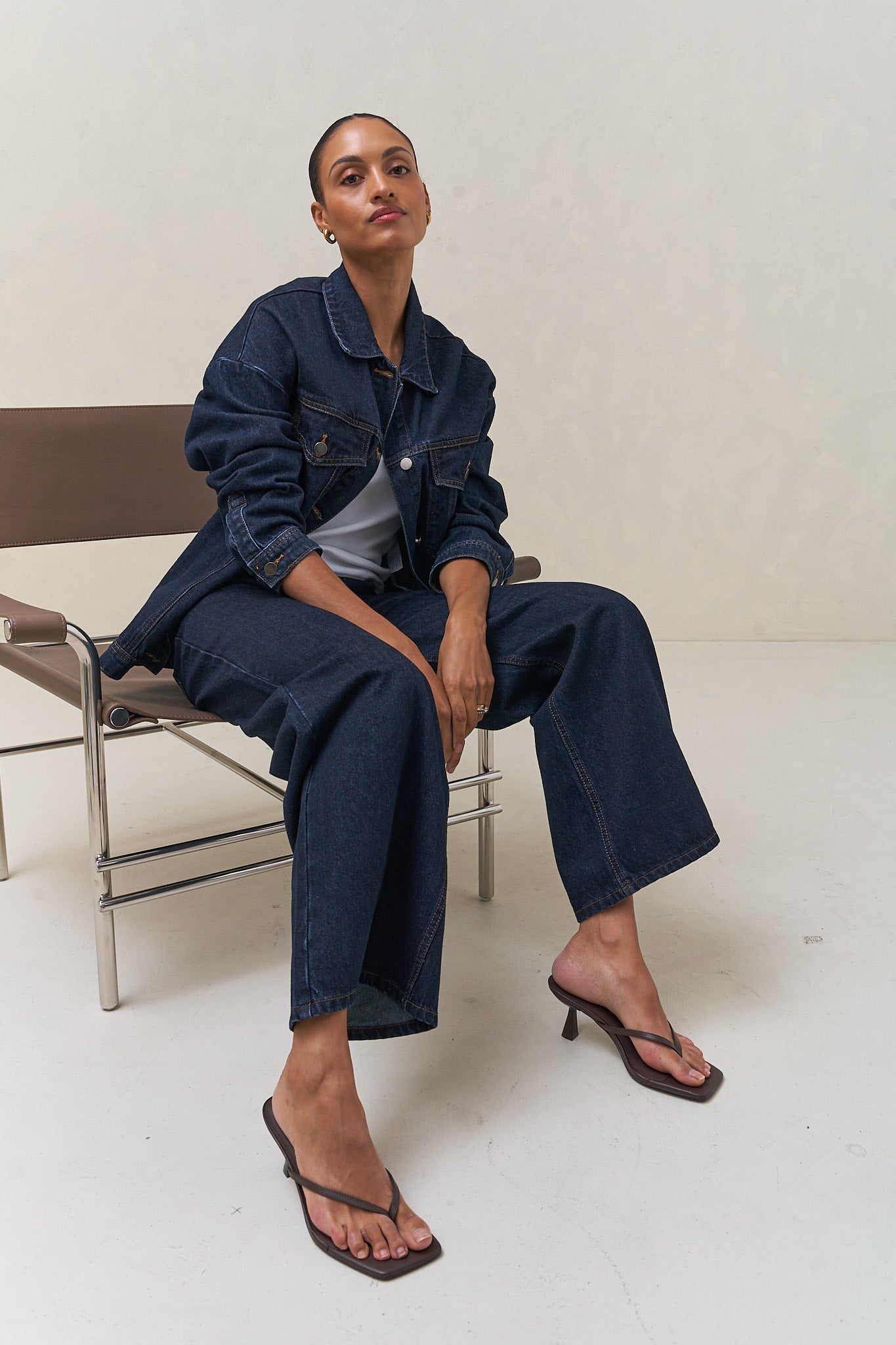 Denim Trucker Jacket - Indigo in rigid denim with a clean silhouette that holds its shape over time for a laid-back, enduring look.