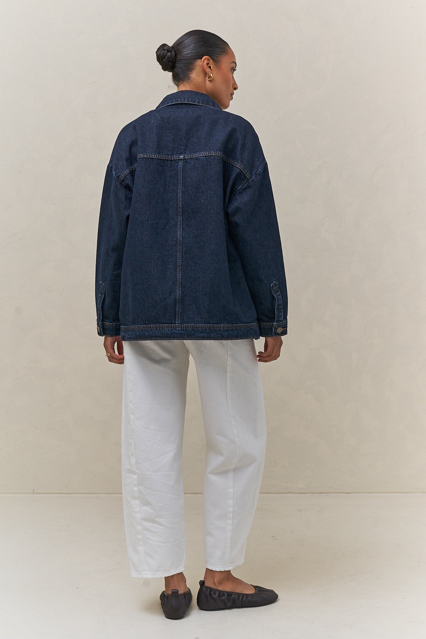 Denim Trucker Jacket - Indigo in rigid denim with a clean silhouette that maintains its shape over time for effortless layering.