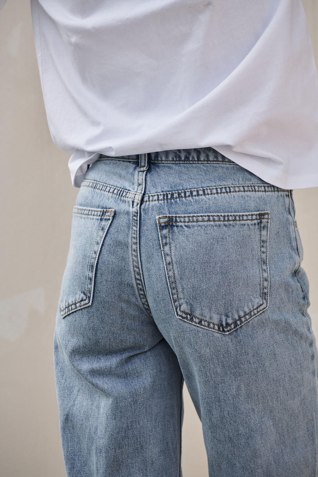 Mid Rise Wide Leg Jean - Light Blue in rigid denim with a fitted waist and hip and clean wide leg for a sharp silhouette.