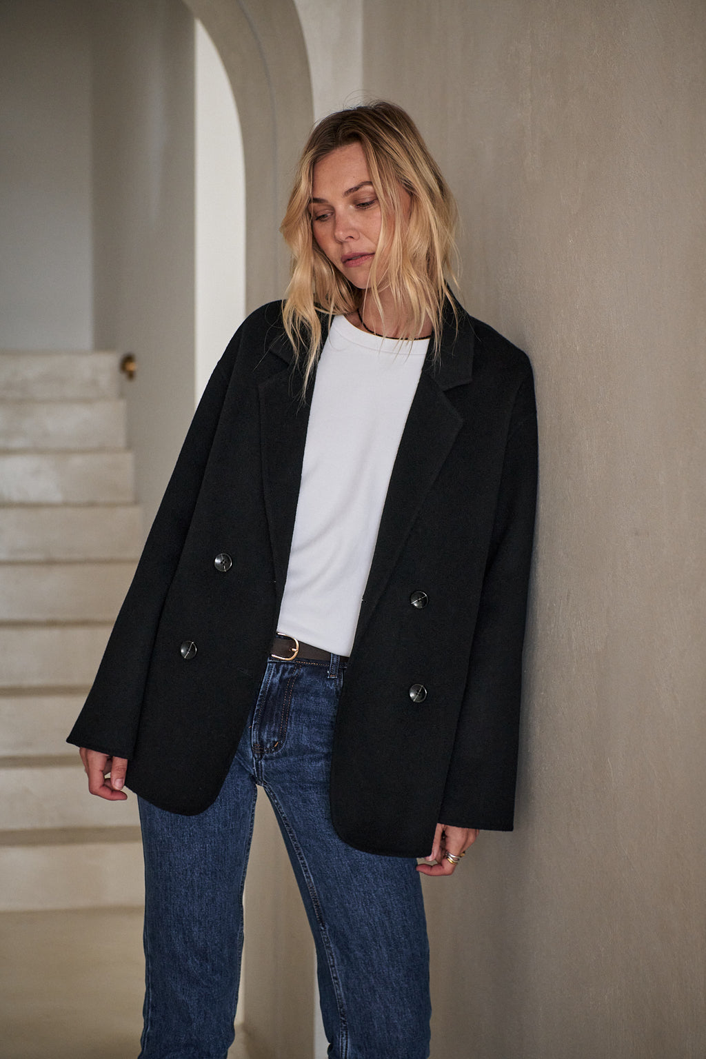 Double Breasted Wool Blazer - Black in a relaxed fit with smooth wool fabric and clean bonded seams for a neat finish.