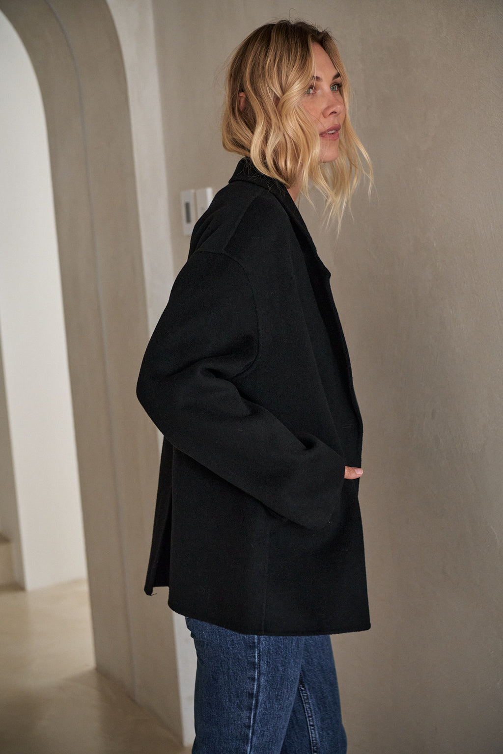Double Breasted Wool Blazer - Black with a structured yet relaxed fit and clean bonded seams for an effortless layer.