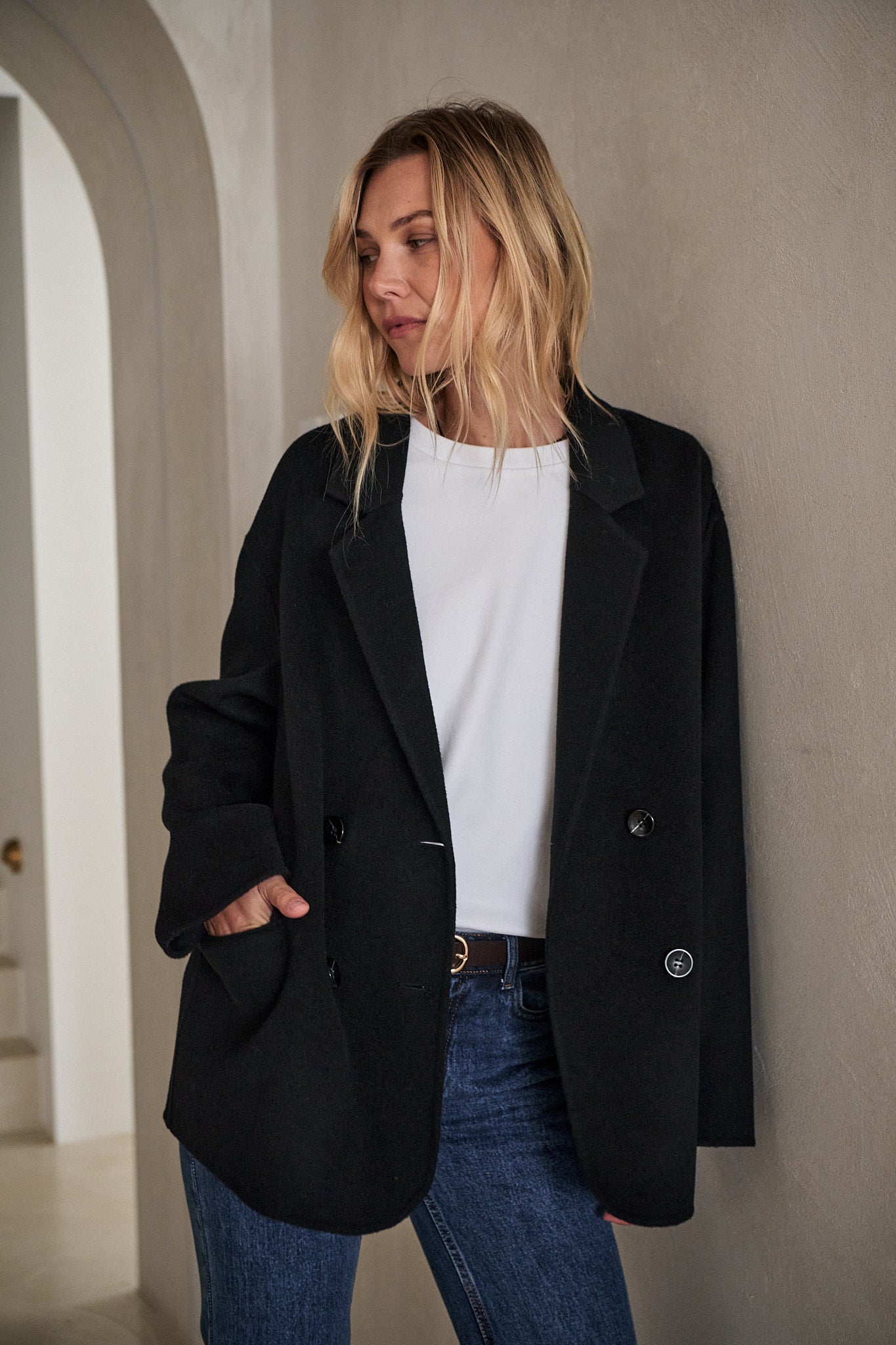 Double Breasted Wool Blazer - Black with a relaxed fit, featuring structured shoulders and a clean interior finish.