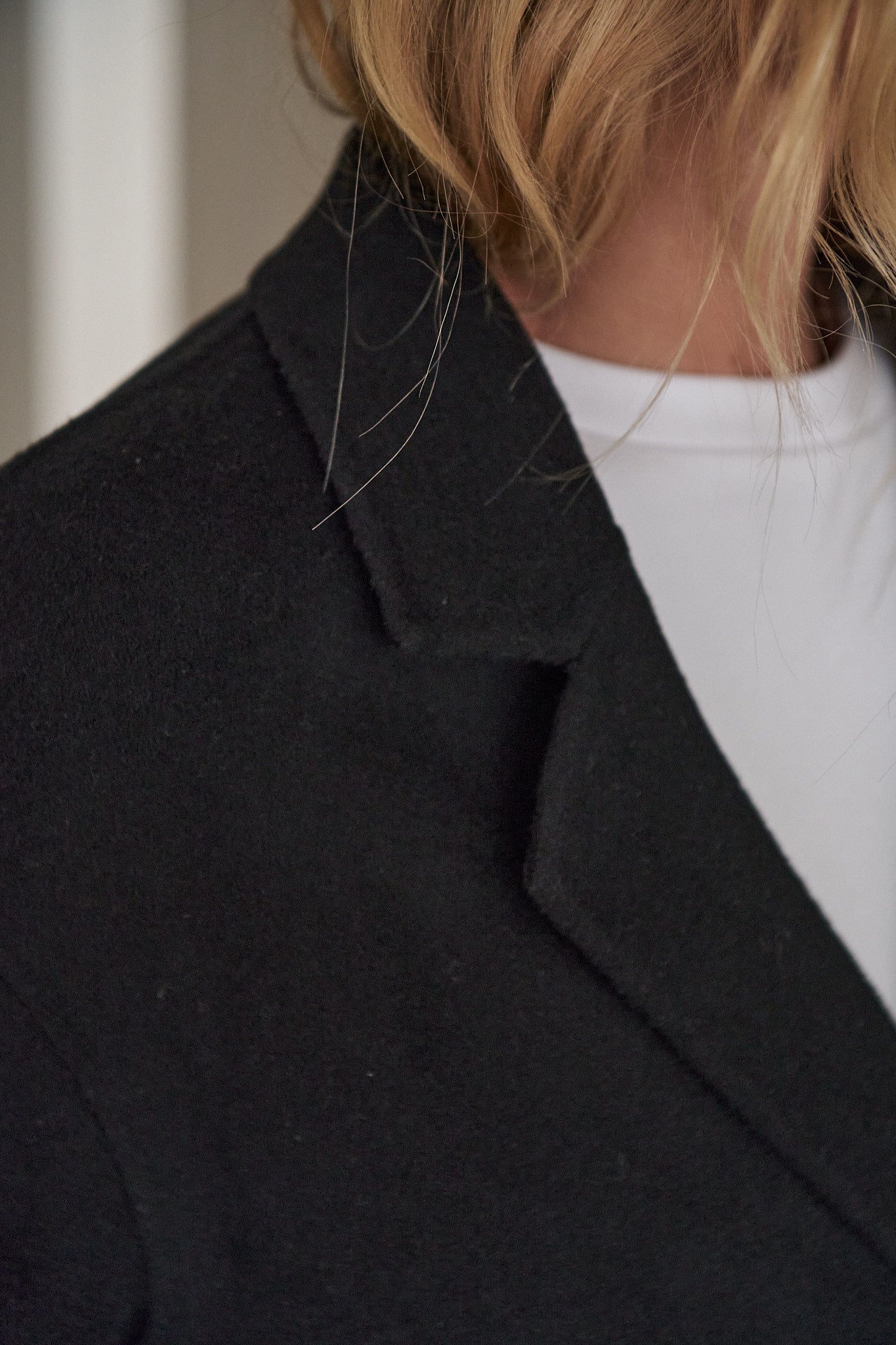 Double Breasted Wool Blazer - Black with a soft wool texture and a sharp lapel for a laid-back yet polished vibe.