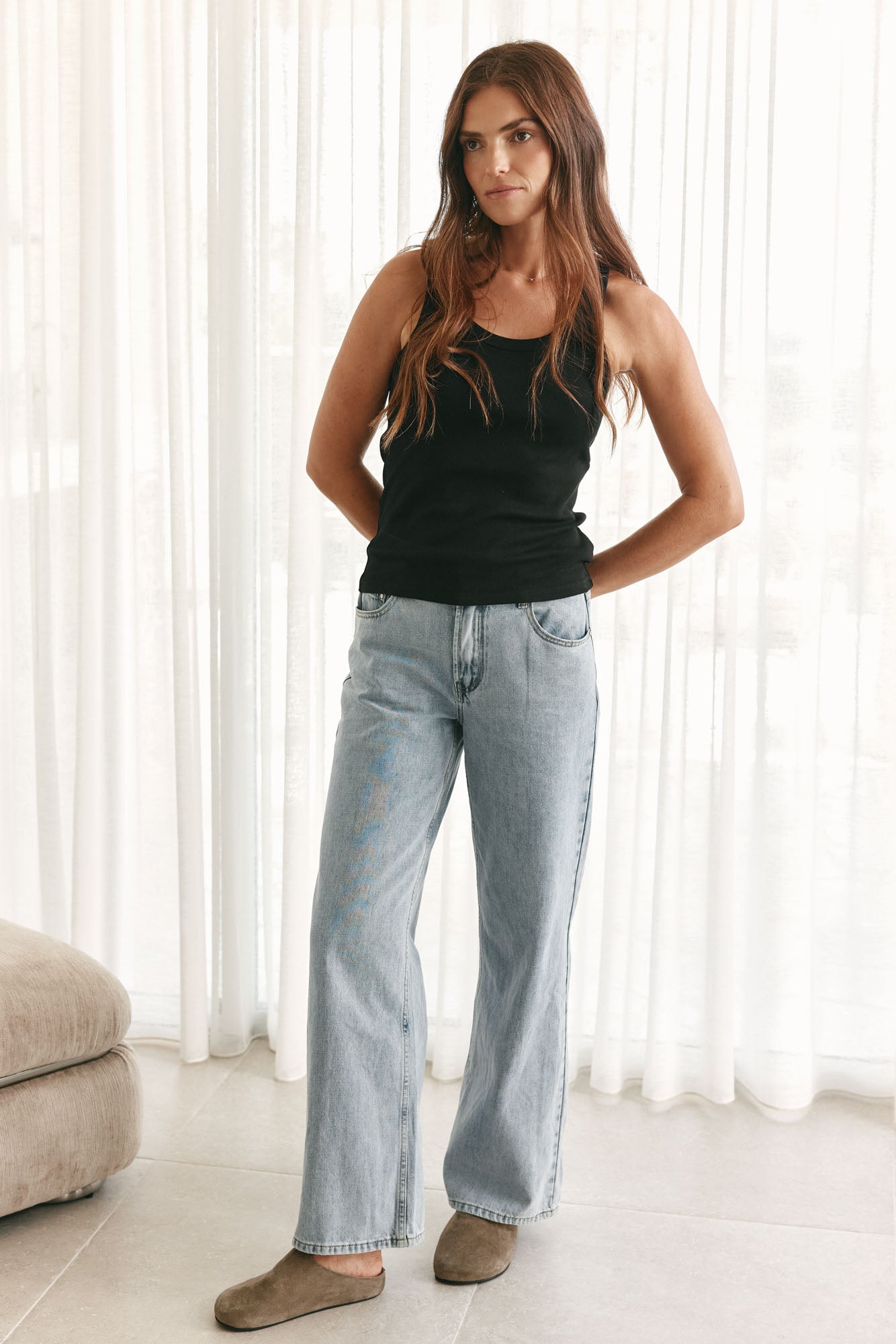 Scoop Neck Rib Tank - Black in a loose rib knit that moves comfortably with the body, perfect for relaxed layering.