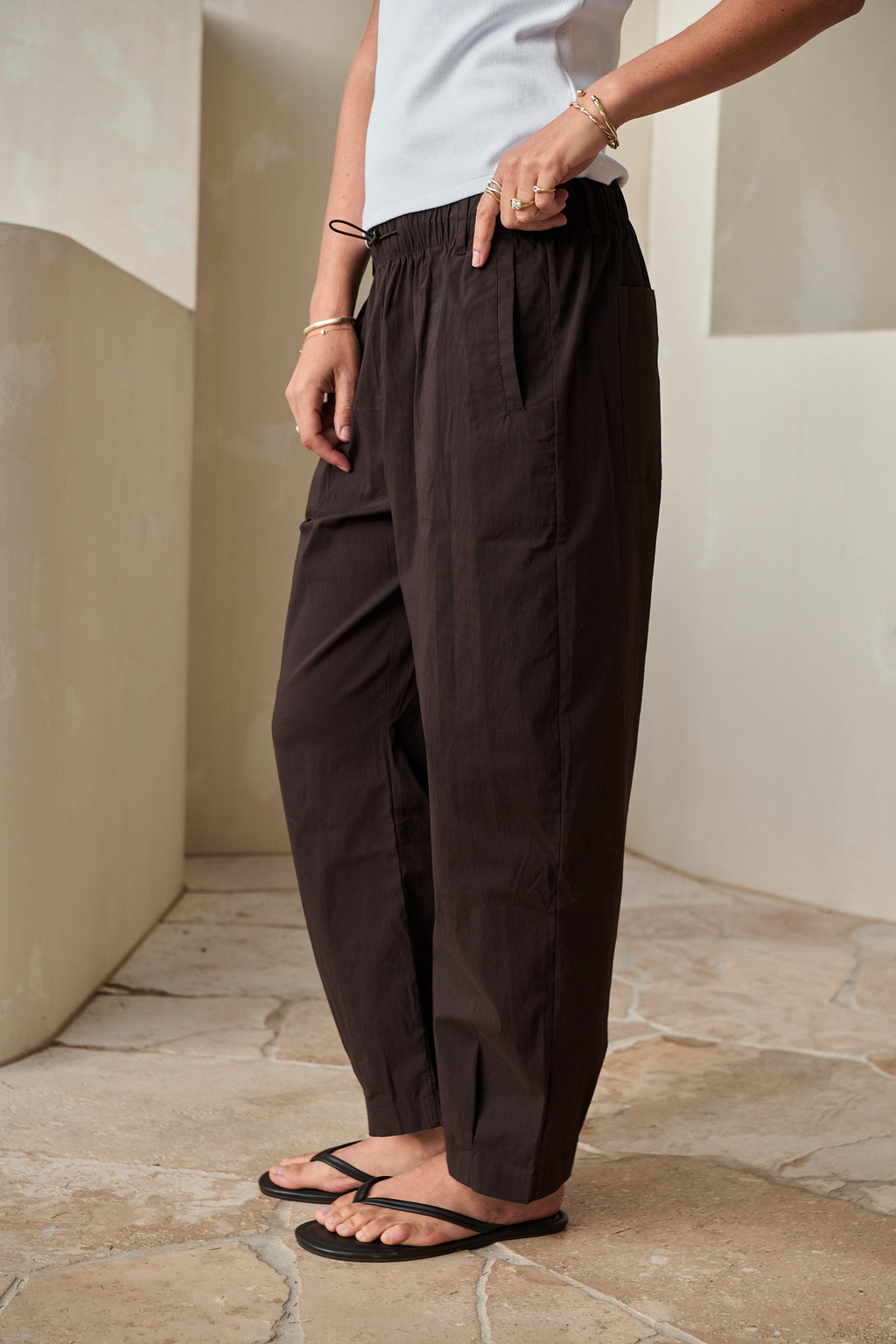 Nylon Barrel Pant - Chocolate in stretch nylon with an adjustable elastic waist and a rounded silhouette.
