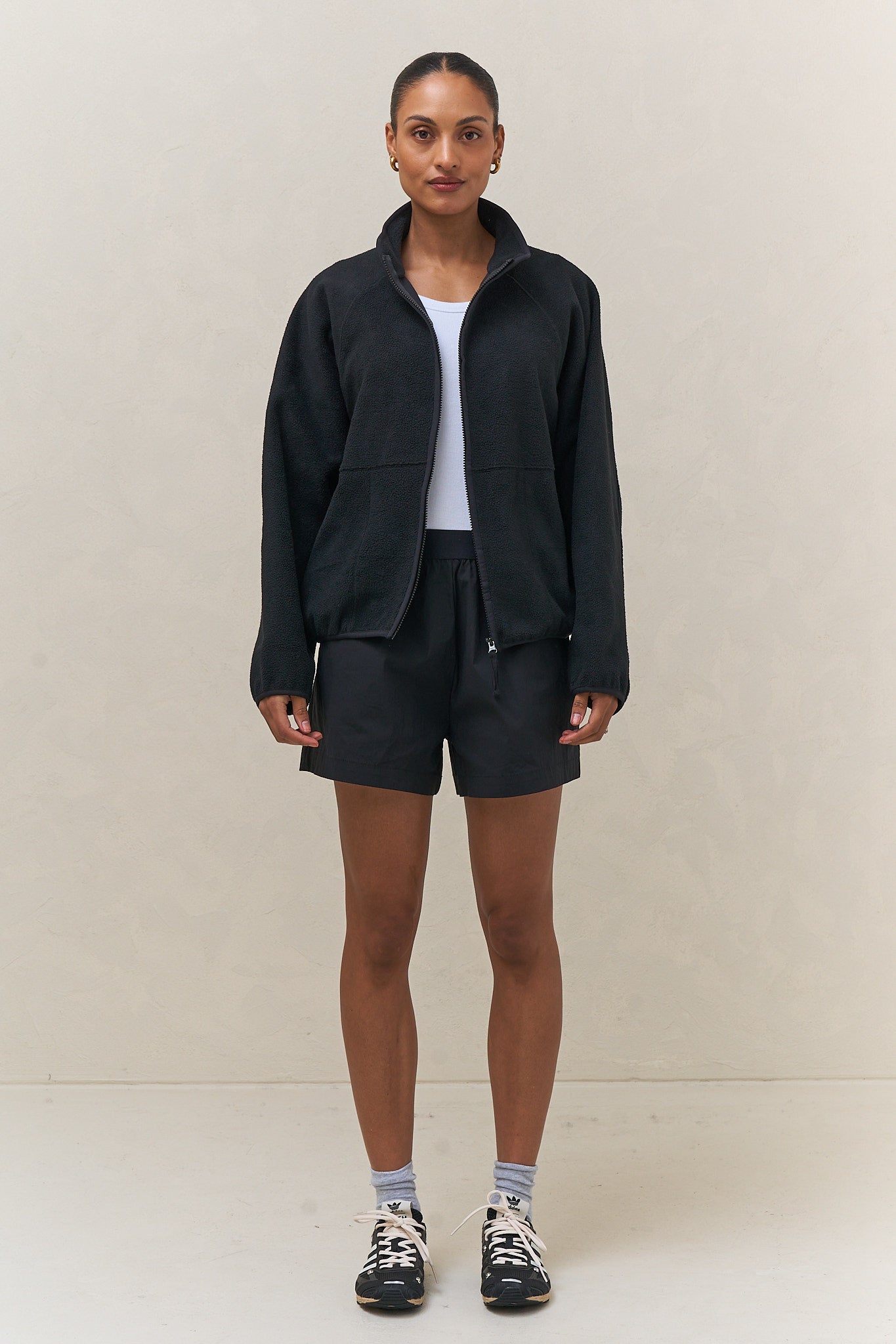 Fleece Zip Sweat - Black in mid-weight fleece with a stand collar and bind detailing for a sleek, casual look.