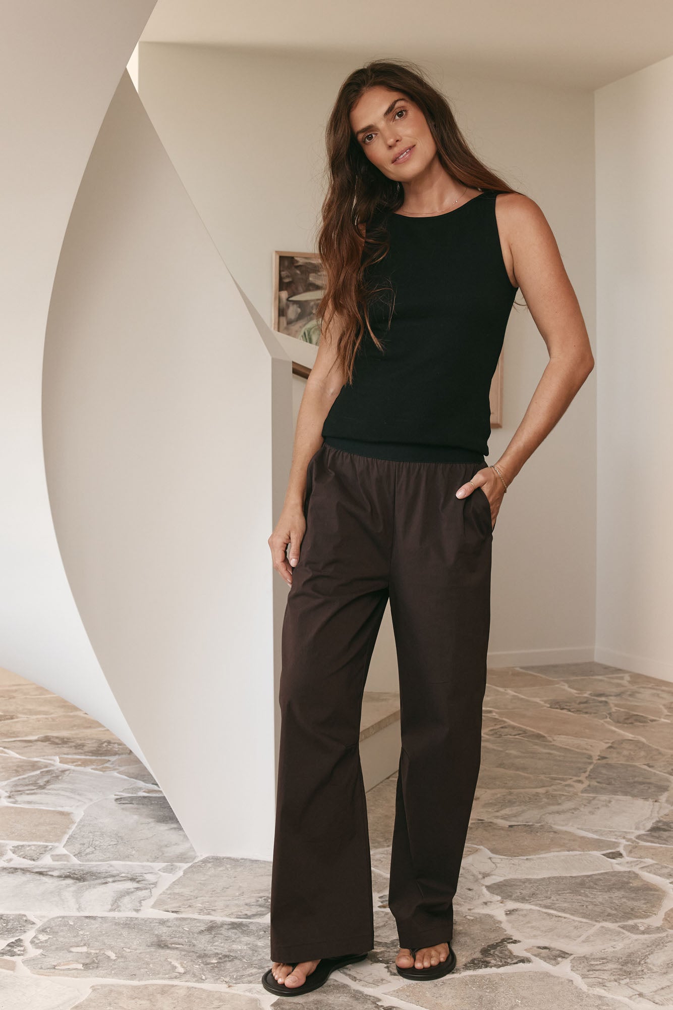 Wide-leg nylon track pant in chocolate brown with a relaxed fit and elastic waistband for easy, comfortable wear.