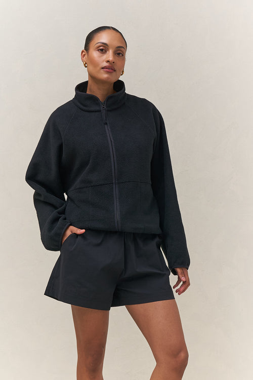 Fleece Zip Sweat - Black mid-weight fleece jacket with a stand collar and bind detailing for a relaxed, casual vibe.