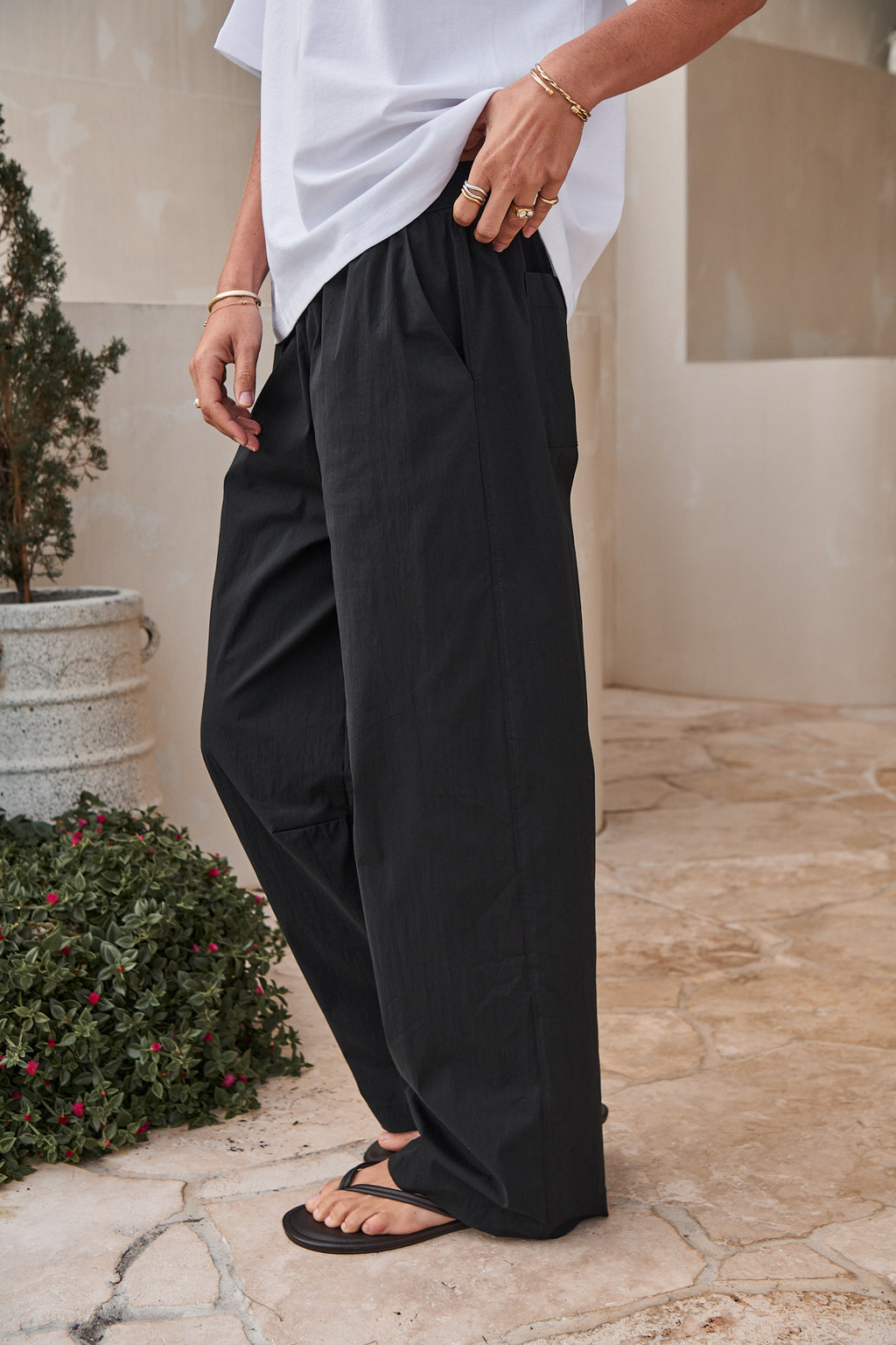 Wide-Leg Nylon Track Pant - Black with a relaxed fit and a smooth, lightweight texture for easy everyday comfort.