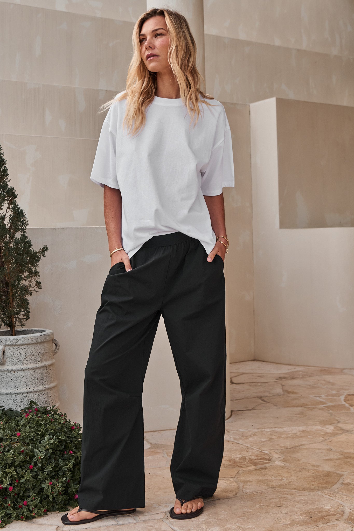 Wide-Leg Nylon Track Pant - Black with a relaxed fit and elastic waist in smooth stretch nylon for easy, comfortable wear.