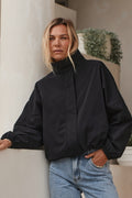 Nylon Track Jacket - Black with a high collar and elasticated cuffs, made from durable nylon fabric for a laid-back, timeless vibe.