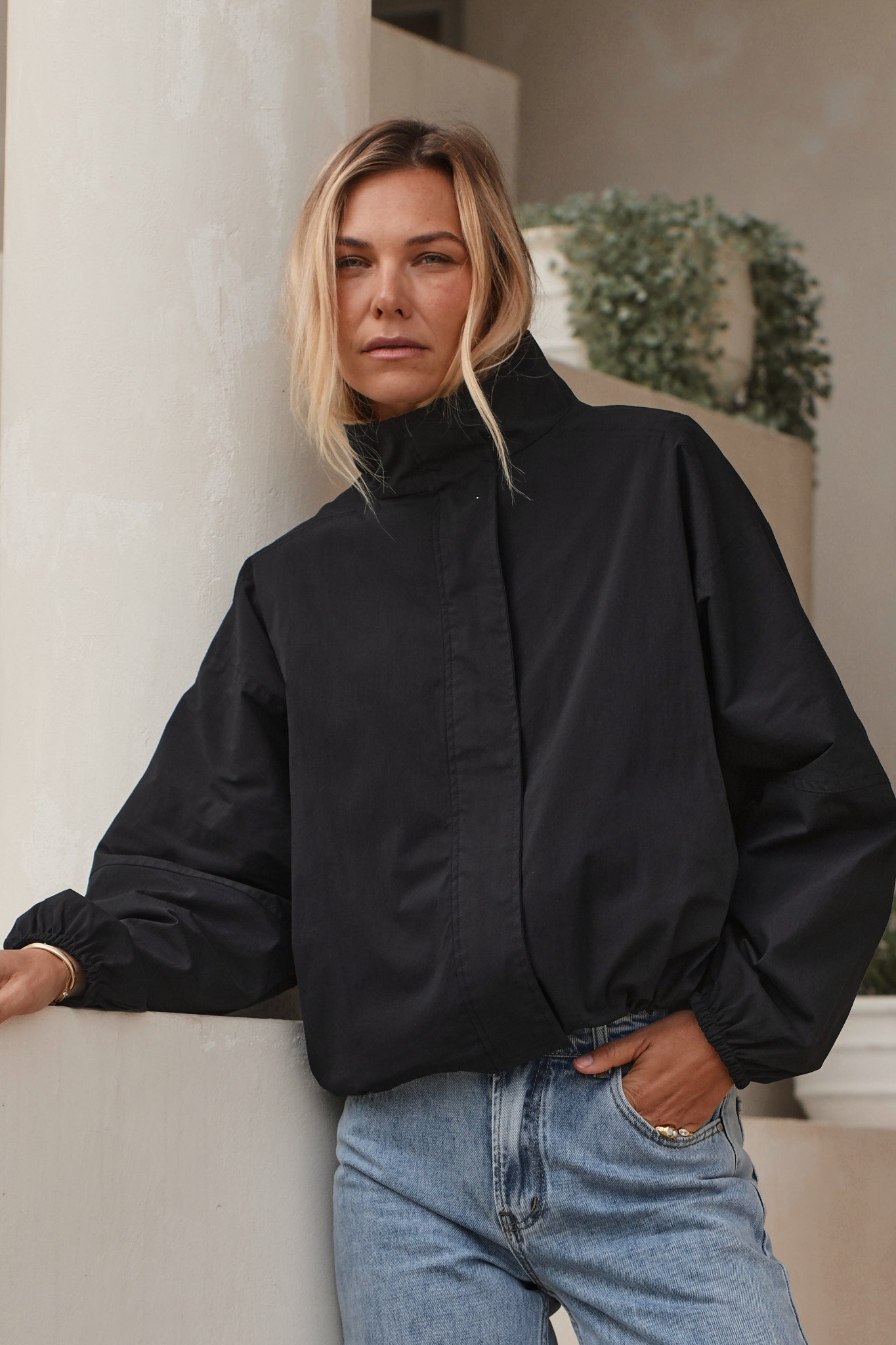 Nylon Track Jacket - Black with a high collar and elasticated cuffs, made from durable nylon fabric for a laid-back, timeless vibe.