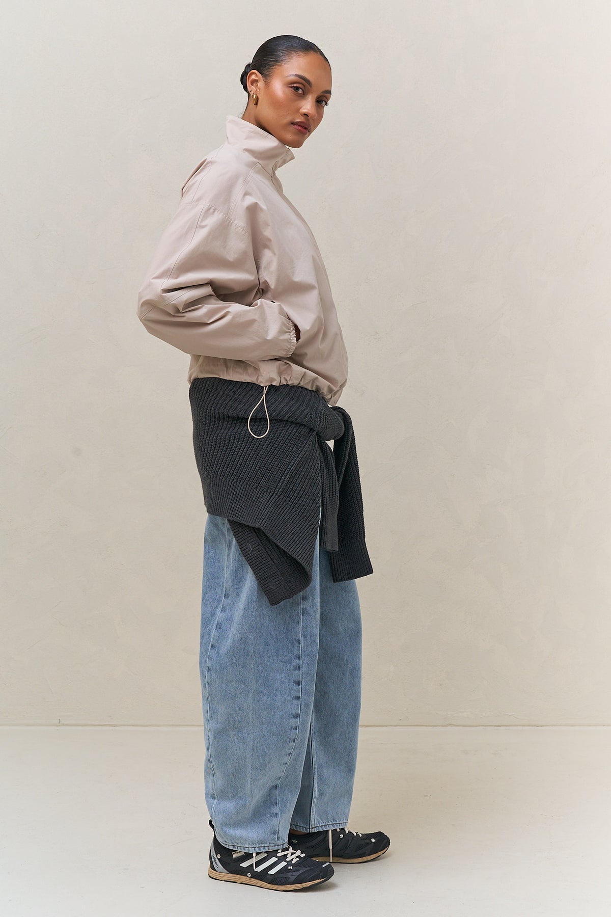 Nylon Track Jacket - Bone, a lightweight nylon track jacket with a stand collar and adjustable hem