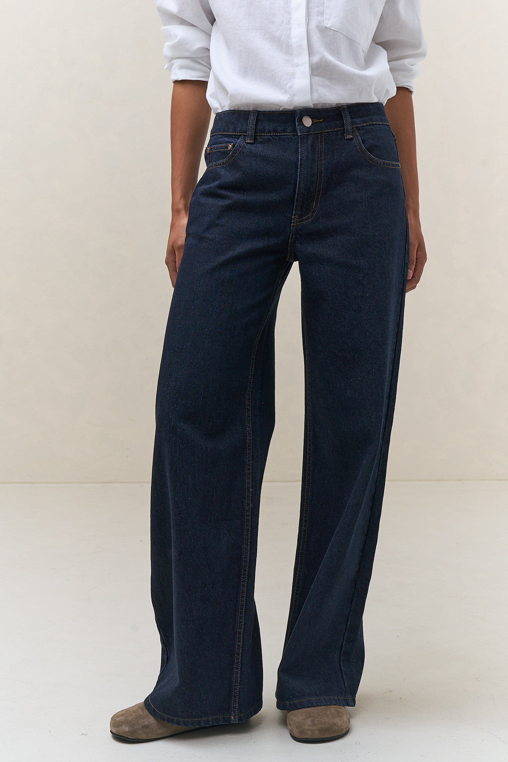Mid Rise Wide Leg Jean - Indigo in rigid denim with a fitted waist and hips and a wide leg that maintains a clean shape.