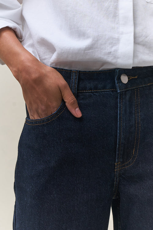 Mid Rise Wide Leg Jean - Indigo in rigid denim with a fitted waist and hip that flows into a clean, wide leg for a modern casual look.