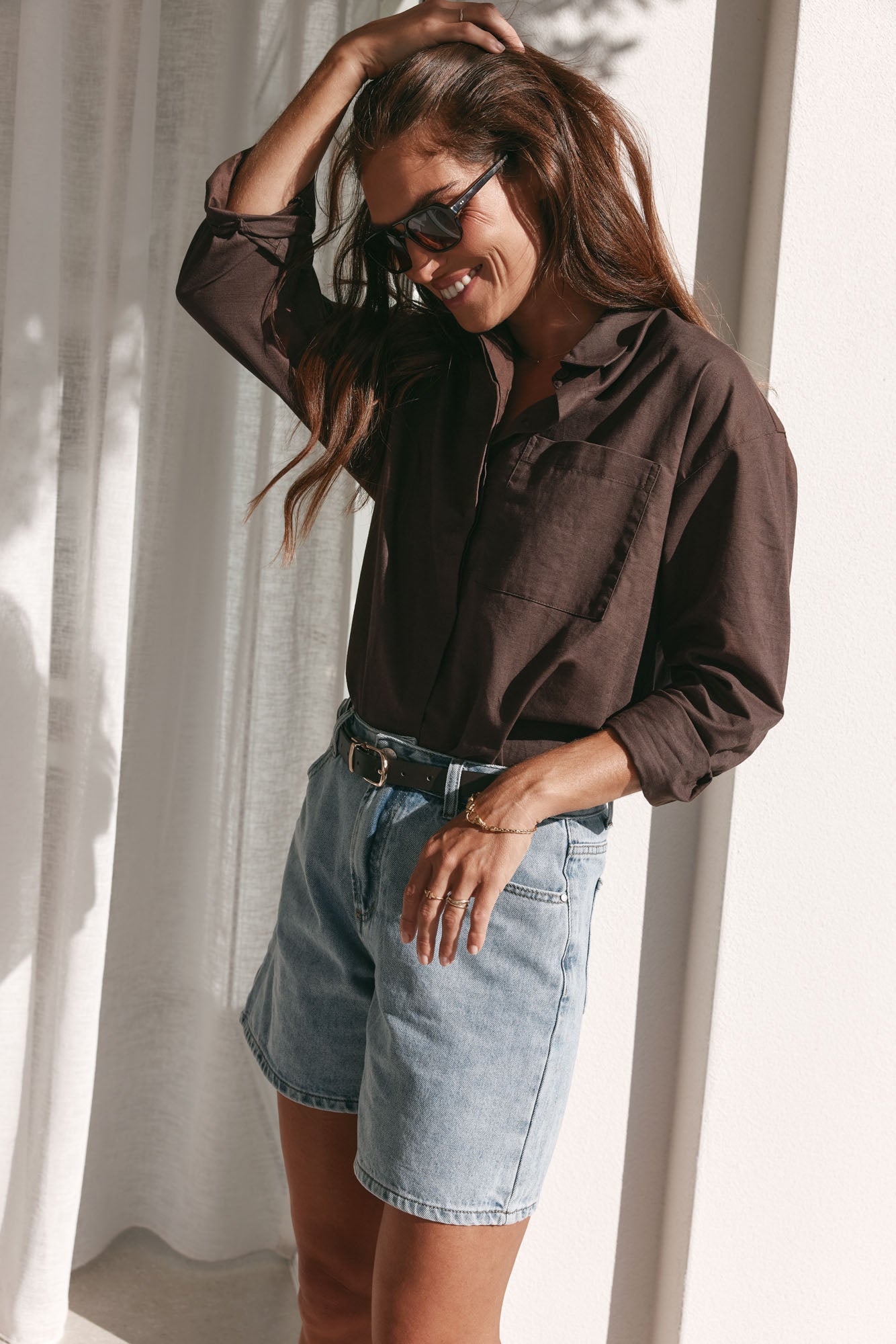 Mid Rise Denim Short - Light Blue in rigid denim with a clean, mid-thigh cut that holds shape all day.