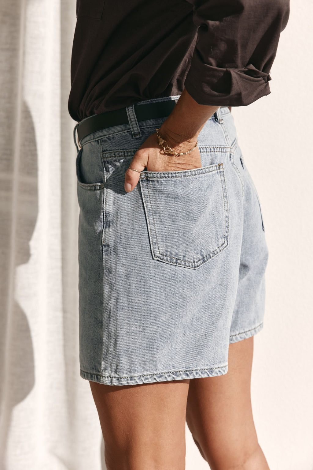 Mid Rise Denim Short - Light Blue in rigid denim with a flattering cut that holds its shape throughout the day.