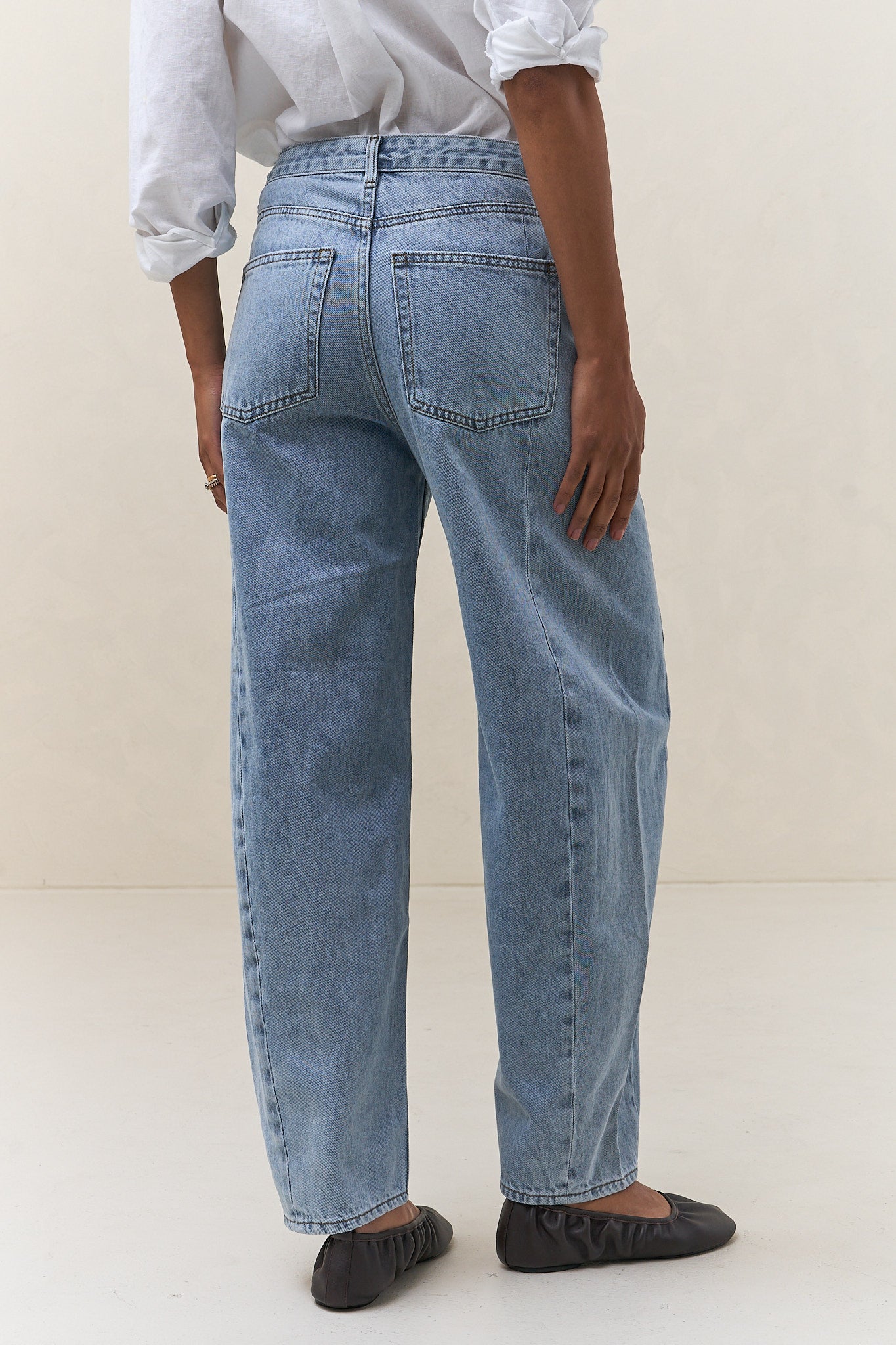 Mid Rise Barrel Jean - Light Blue in a relaxed fit denim with classic back pockets for effortless casual womenswear.