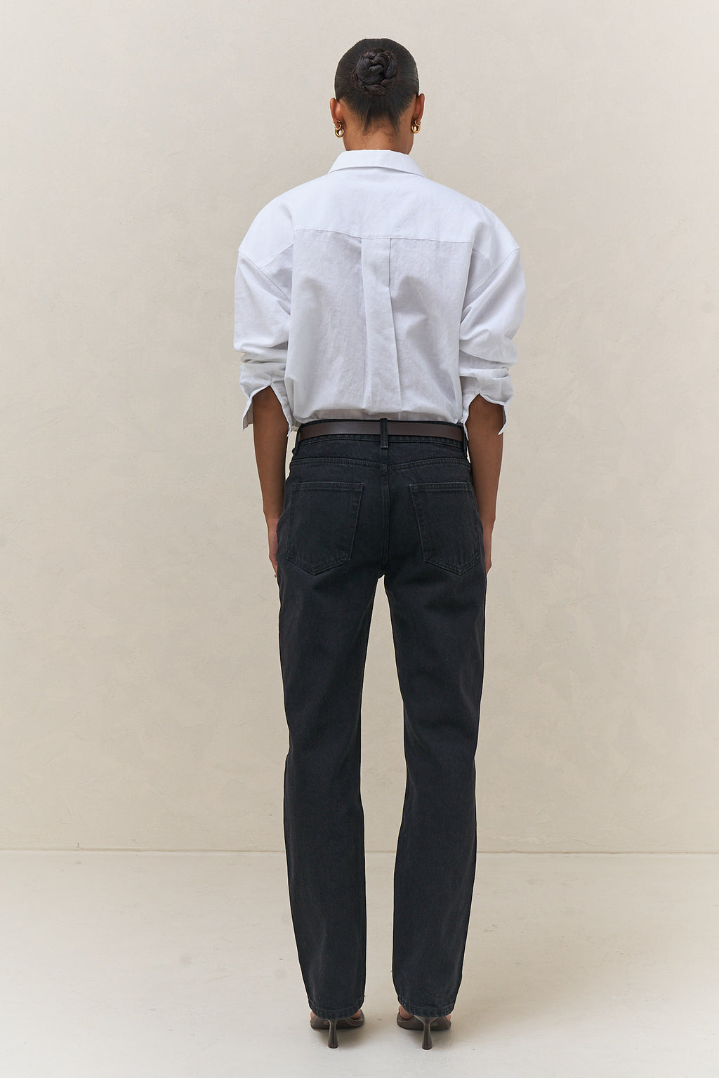Mid Rise Straight Jean - Black in firm denim with a slim, straight leg silhouette that maintains its shape over time.