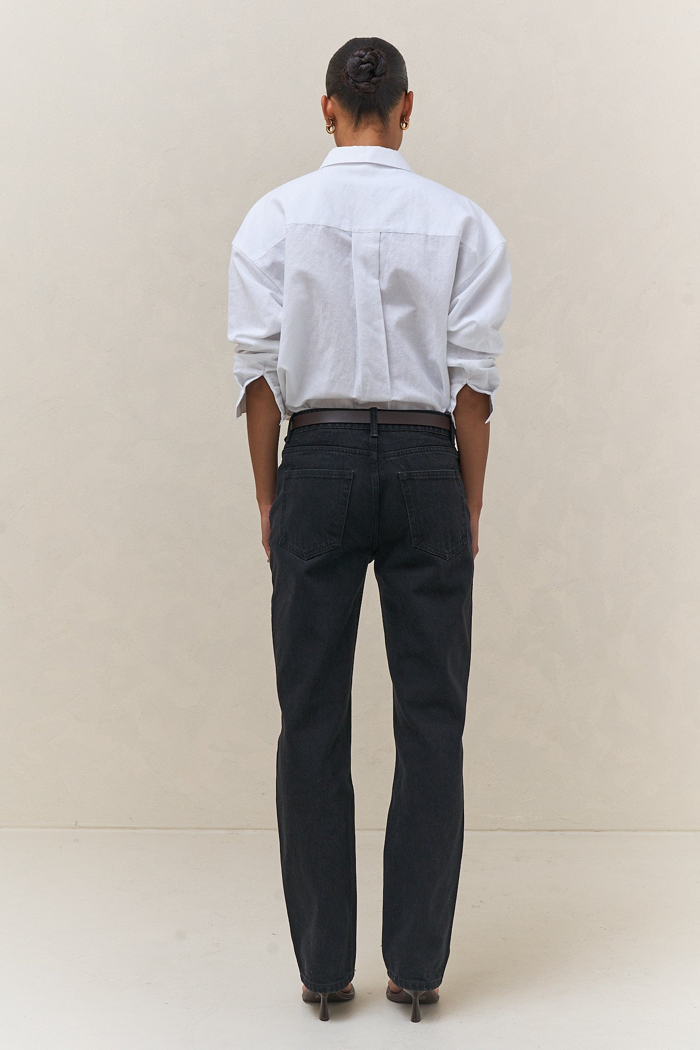 Mid Rise Straight Jean - Black in firm denim with a slim, straight leg silhouette that maintains its shape over time.
