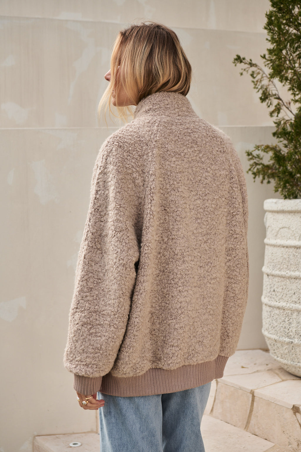 Wool Bomber Jacket in beige heavyweight boucle wool blend with ribbed cuffs and hem for laid-back layering.