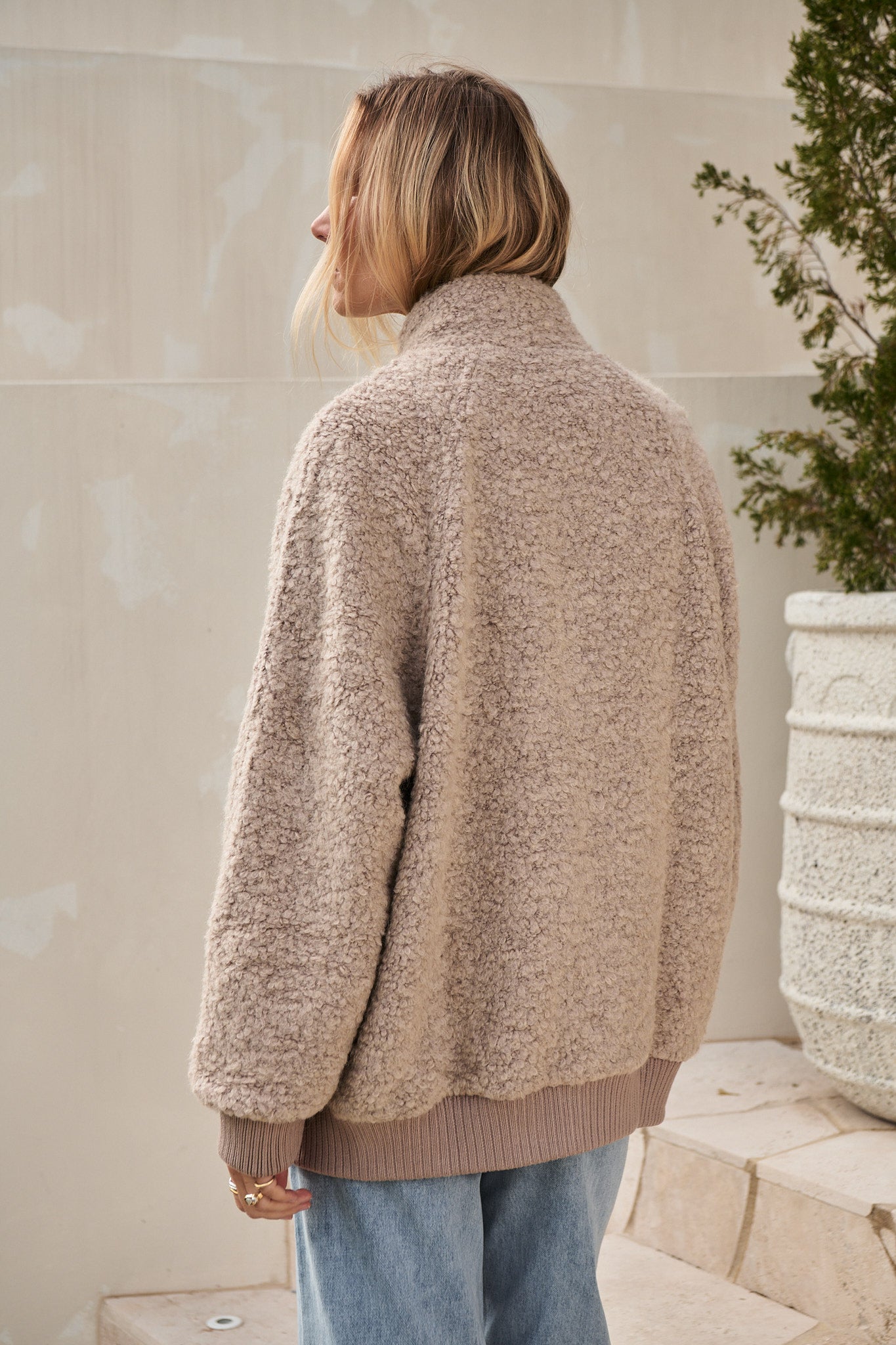 Wool Bomber Jacket in beige heavyweight boucle wool blend with ribbed cuffs and hem for laid-back layering.