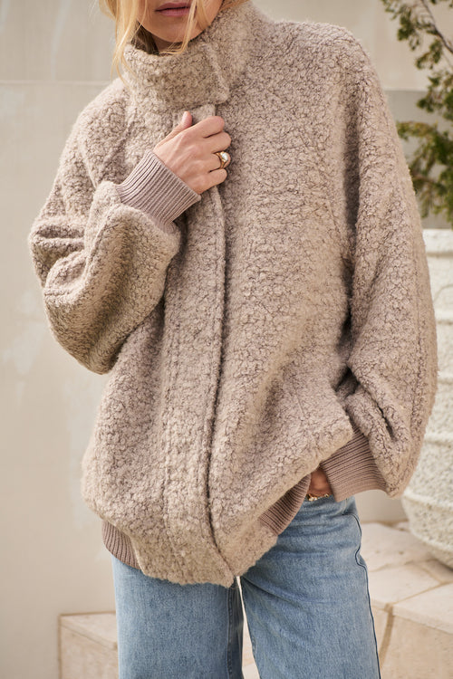 Wool Bomber Jacket in a beige heavyweight boucle wool blend with ribbed cuffs and hem for cozy layering.