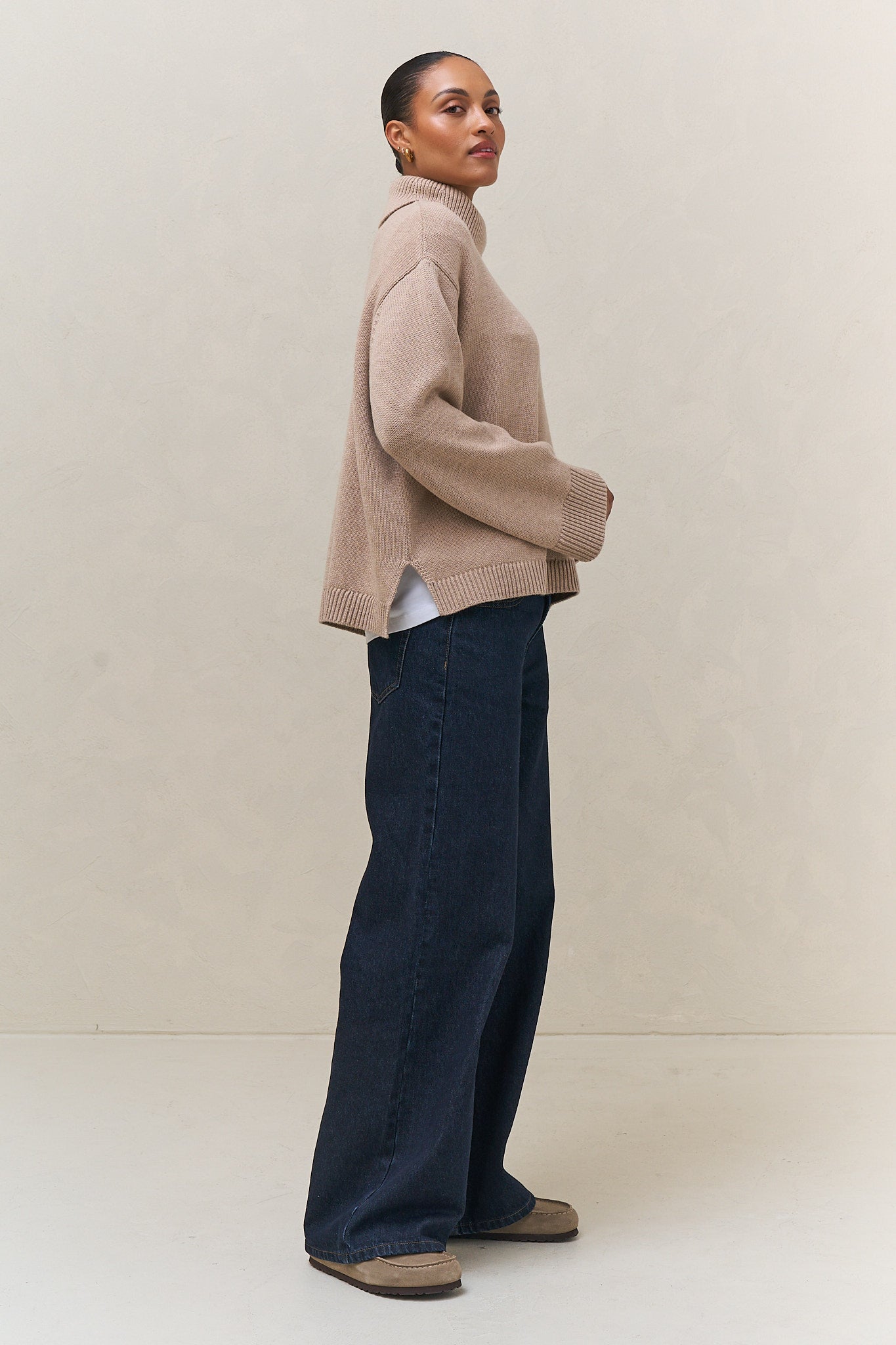 Merino Cotton Roll Neck Jumper - Suede in a soft beige with a relaxed fit and ribbed cuffs, crafted from durable merino cotton for comfortable womens knitwear.