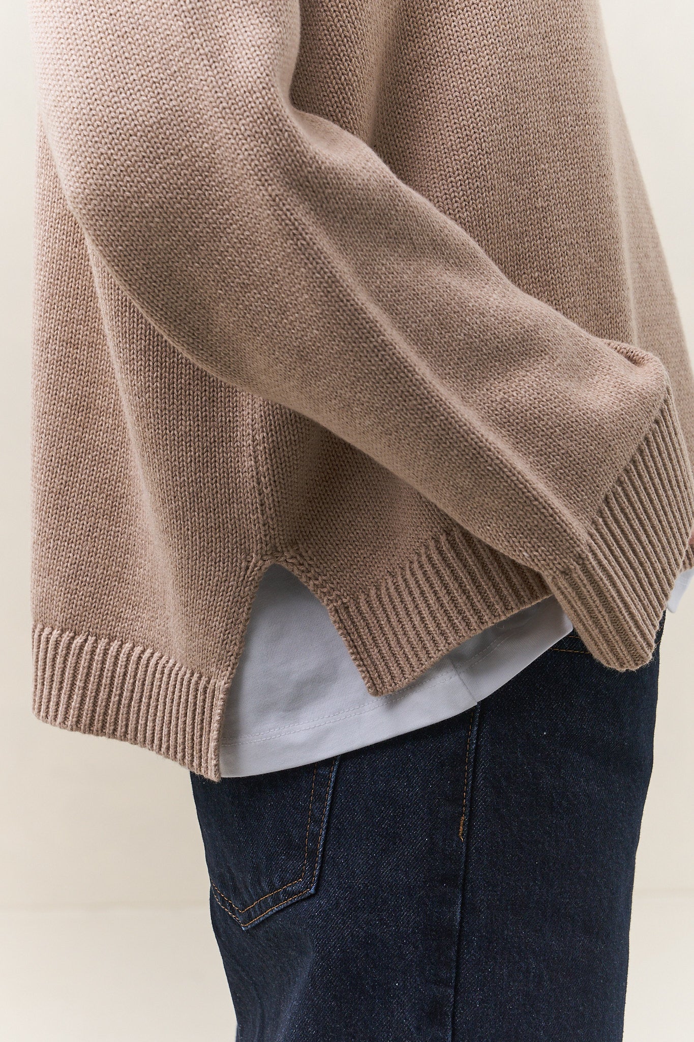 Merino Cotton Roll Neck Jumper - Suede in soft knit with a relaxed fit and slit hem, crafted from merino cotton for comfortable womens knitwear.