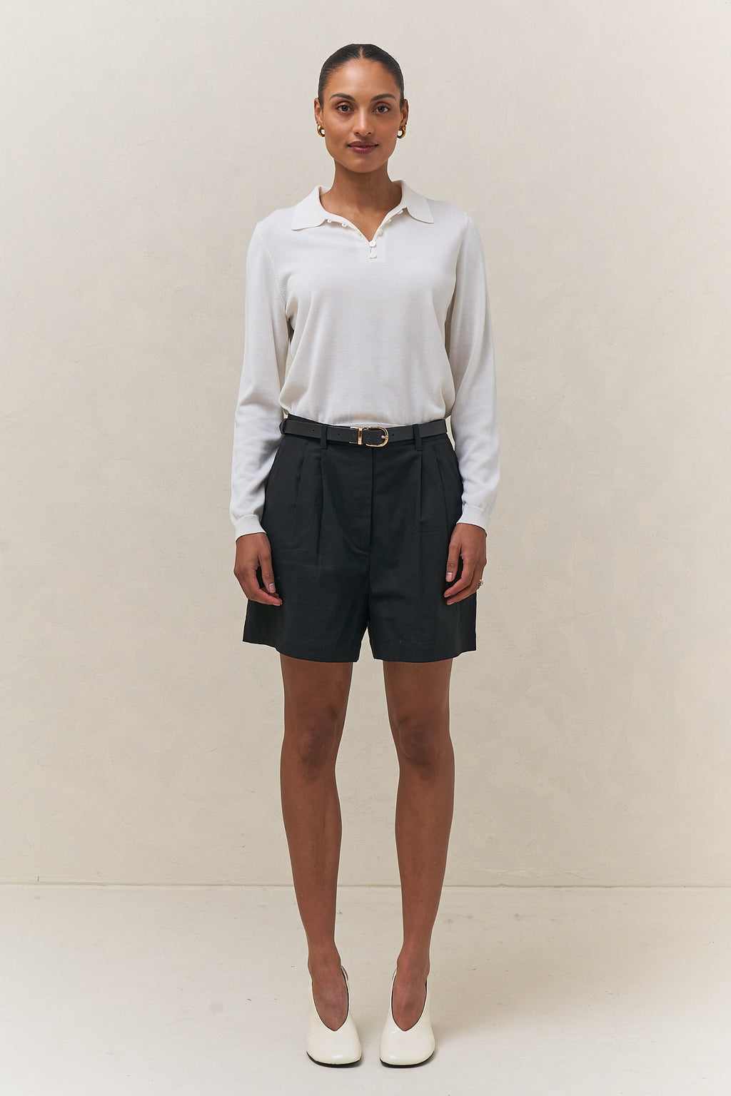 Tailored linen short - black featuring a high waist and pleated front for an easy, polished vibe.