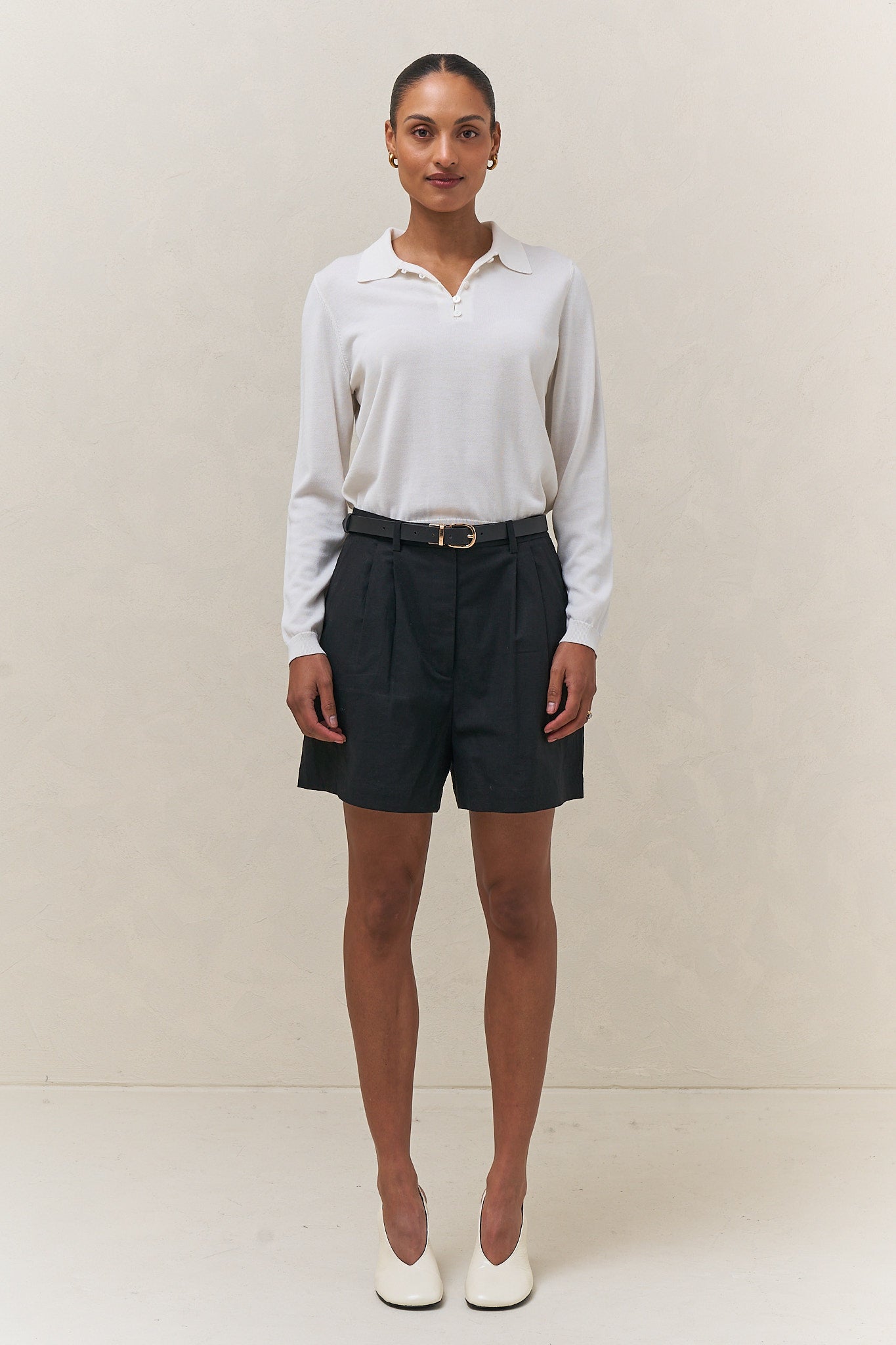 Tailored linen short - black featuring a high waist and pleated front for an easy, polished vibe.